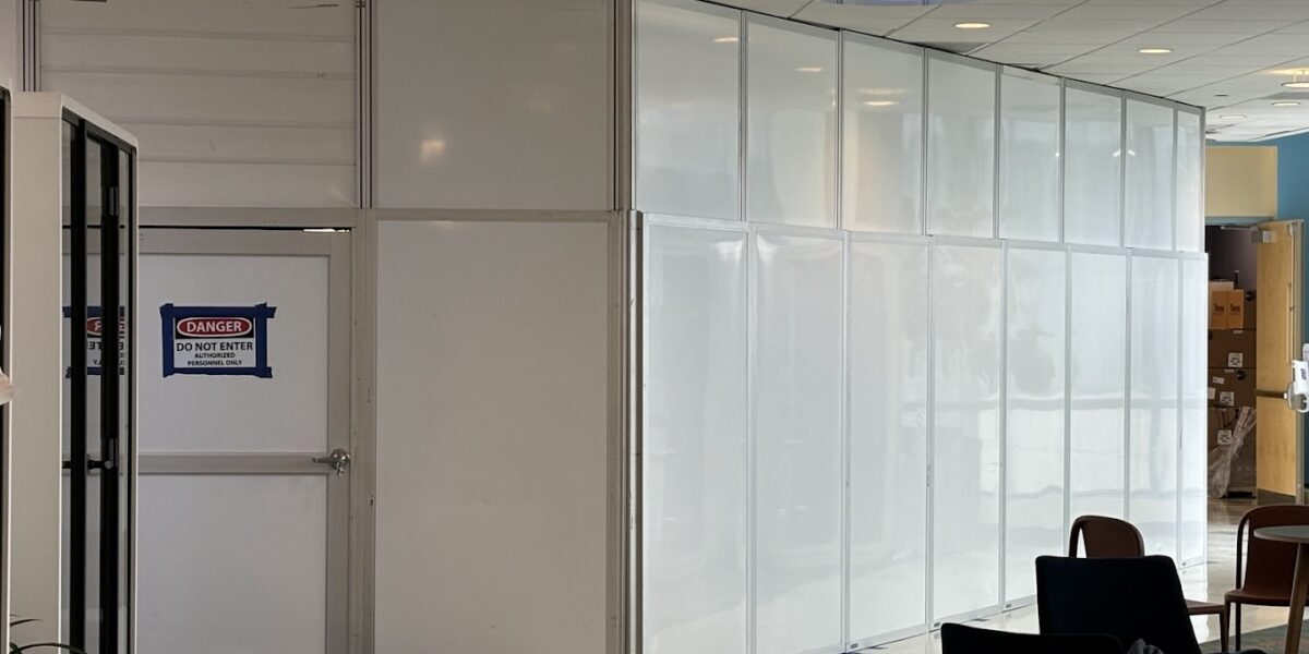Temporary wall system installation in commercial renovation project